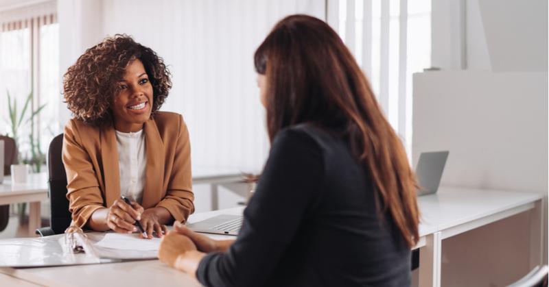 Manager discussing employee development with a colleague